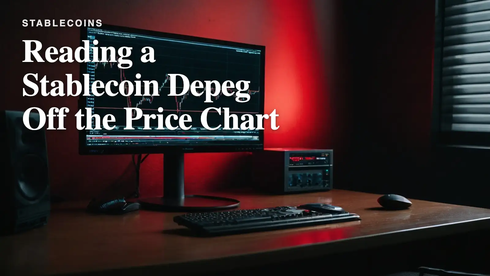 A dark monitor showing a steep red price line, its glow spilling across the desk.