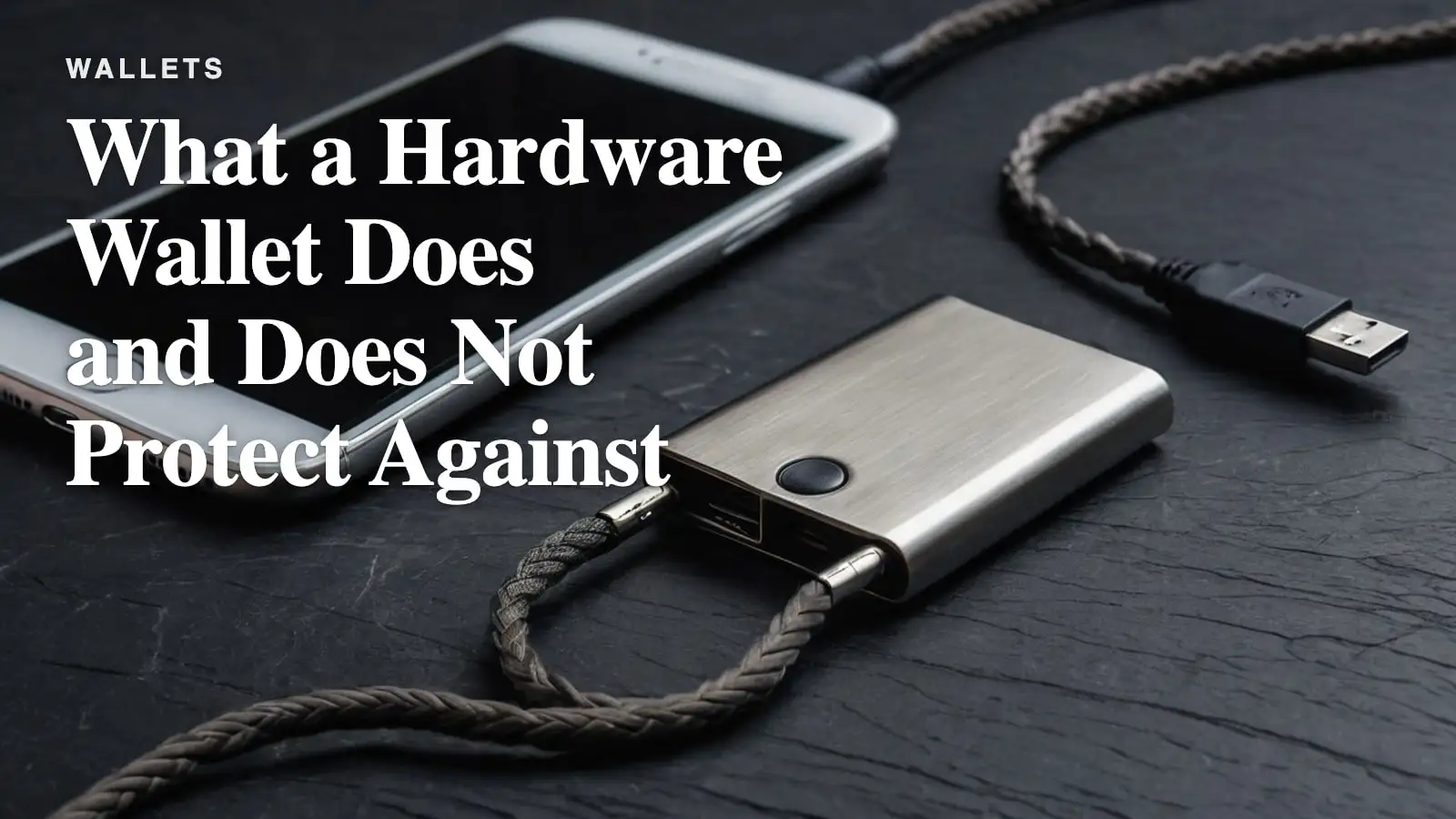 A brushed steel hardware wallet beside a braided USB cable on a dark desk, cool rim light.