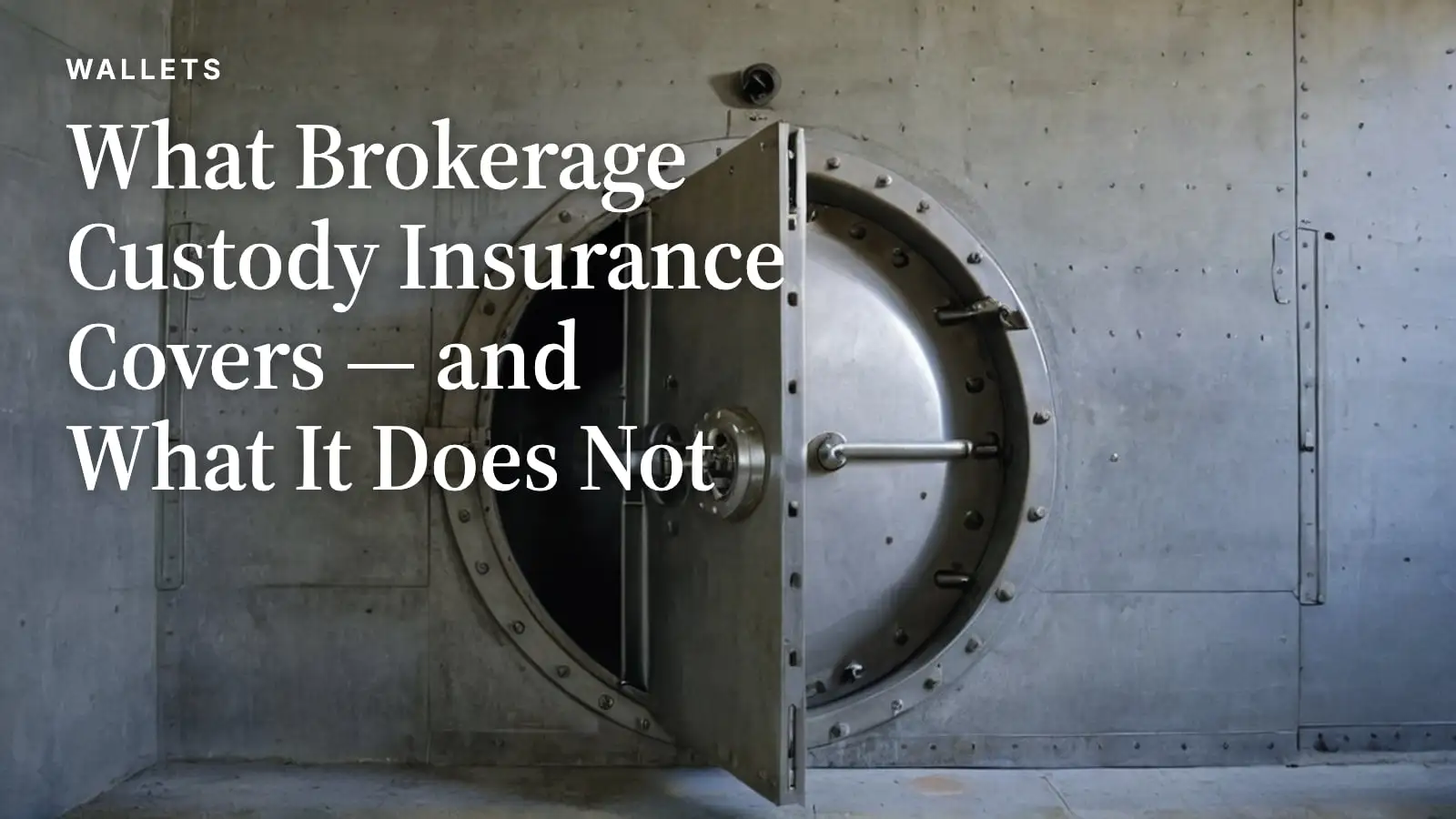 A heavy round steel vault door standing half open in a concrete vault wall, rows of locking bolts around its rim.